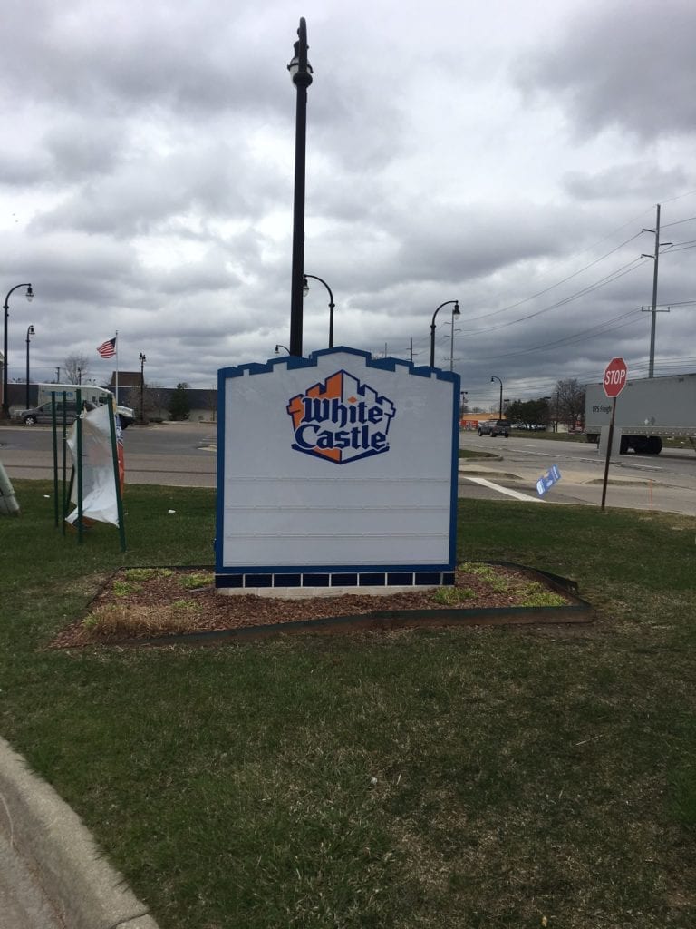 White Castle Monument sign white and blue fast food with reader board