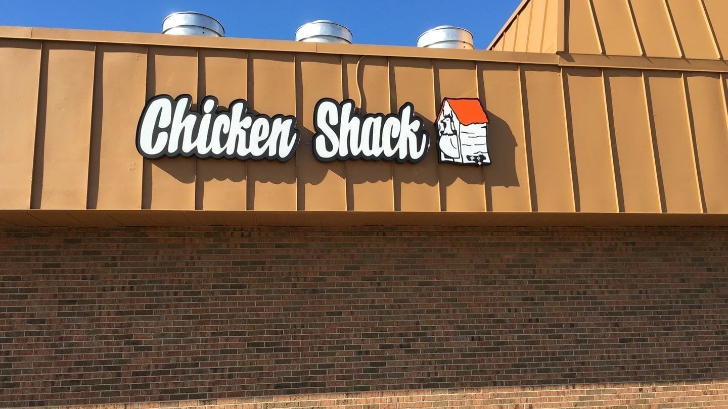 Chicken Shack Channel Letters, white letters outlined in black with orange logo