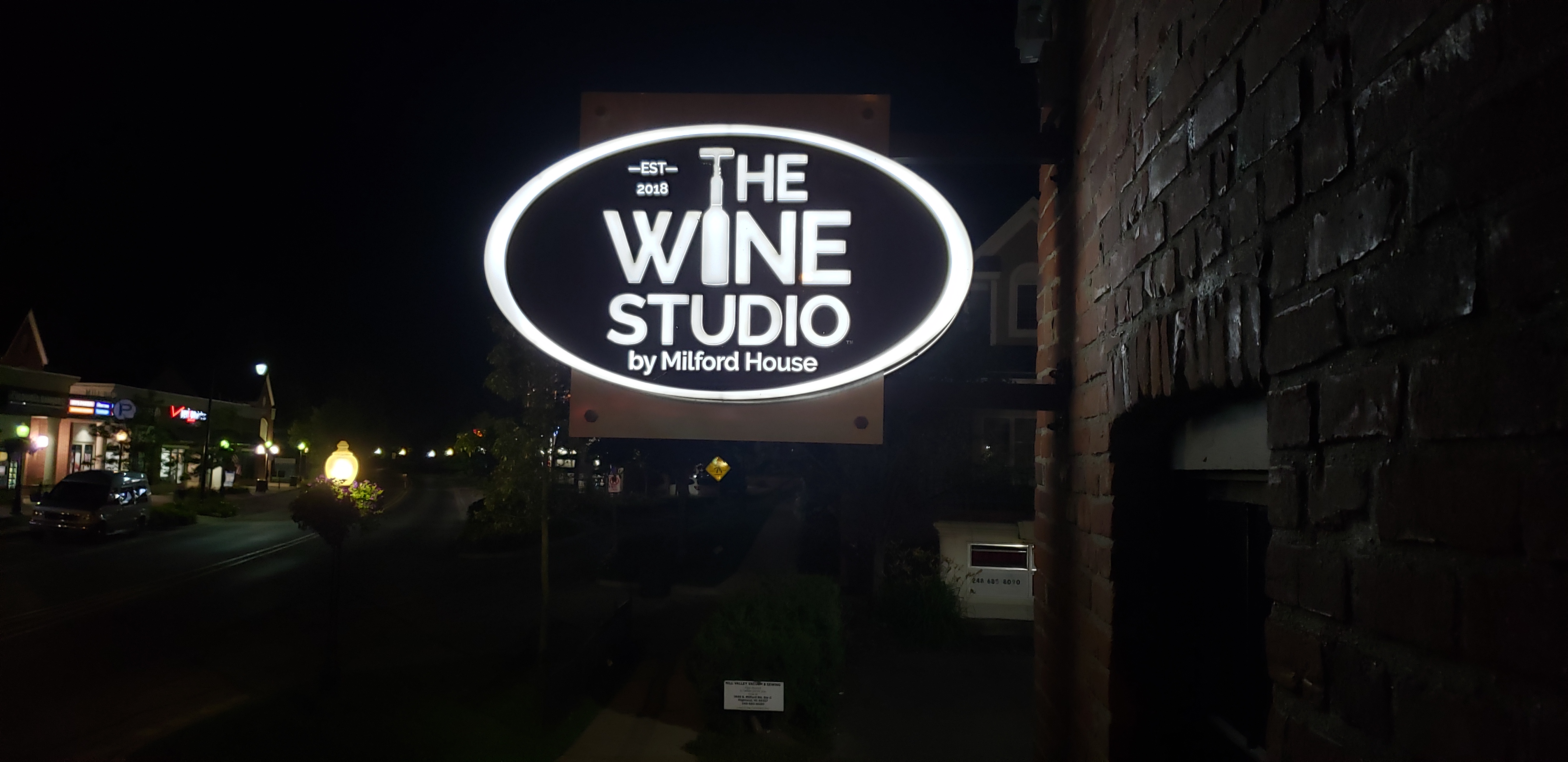 The Wine Studio Illuminating blade sign push thru