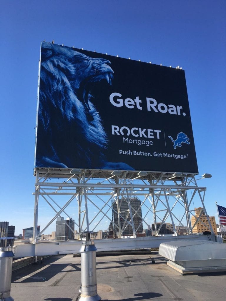 Rocket Mortgage Detroit Lions Billboard "Get Roar." "push Button. Get Mortgage." Blue Lion roaring banner temporary signs