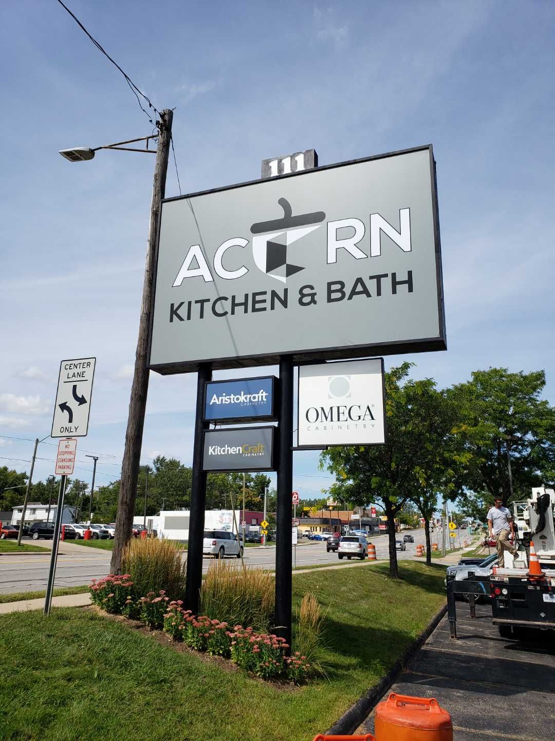 Acorn Kitchen and Bath Pylon double Pole roadside sign Multiple cabinet logo faces