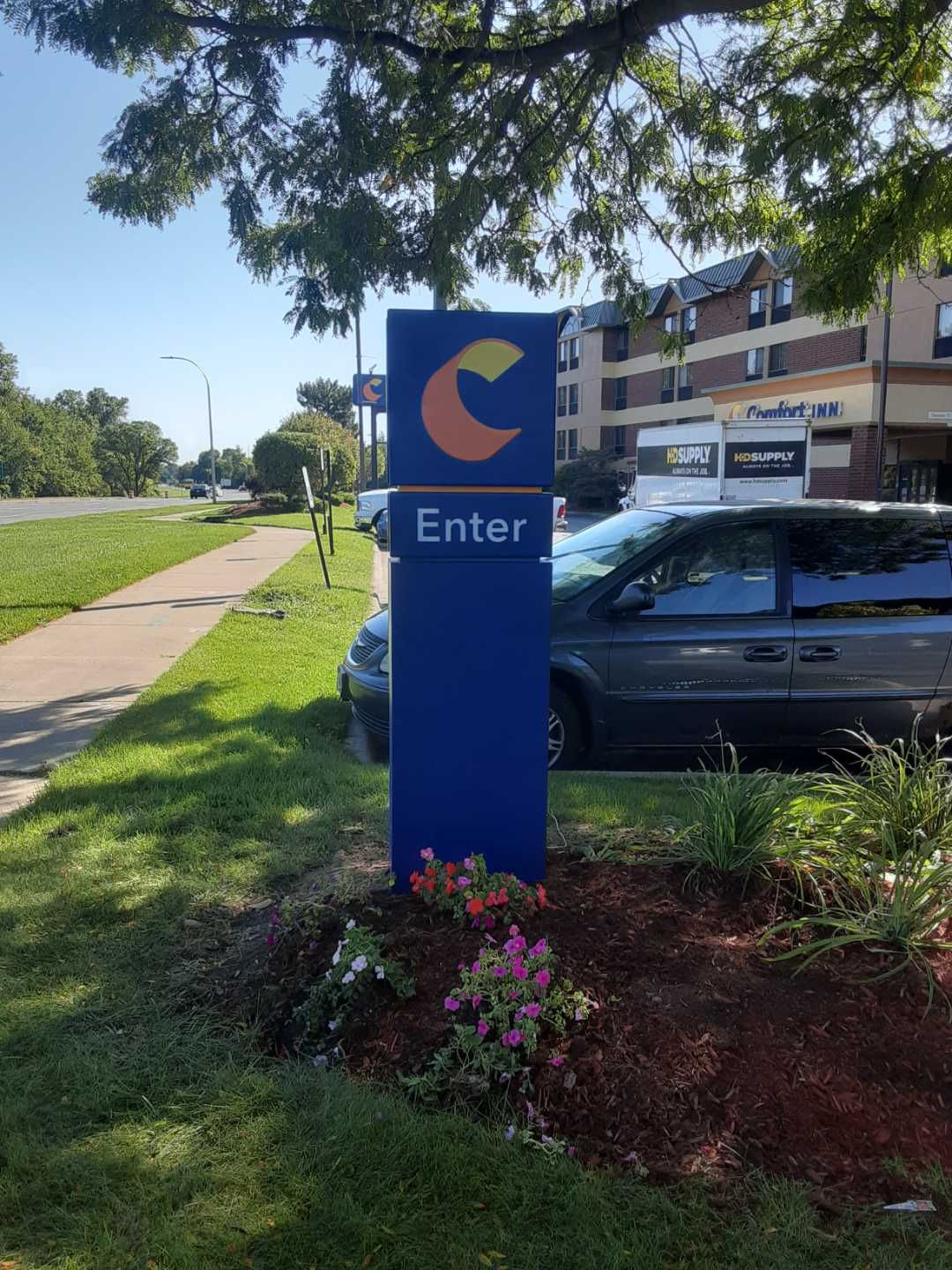 Comfort Inn Directional Hotel Wayfinding Enter Sign Blue and Yellow and Orange