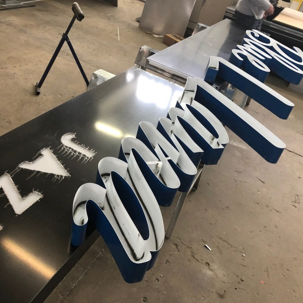 Manufacturing in shop of Blue Llama Sign, Downtown Grand Rapids