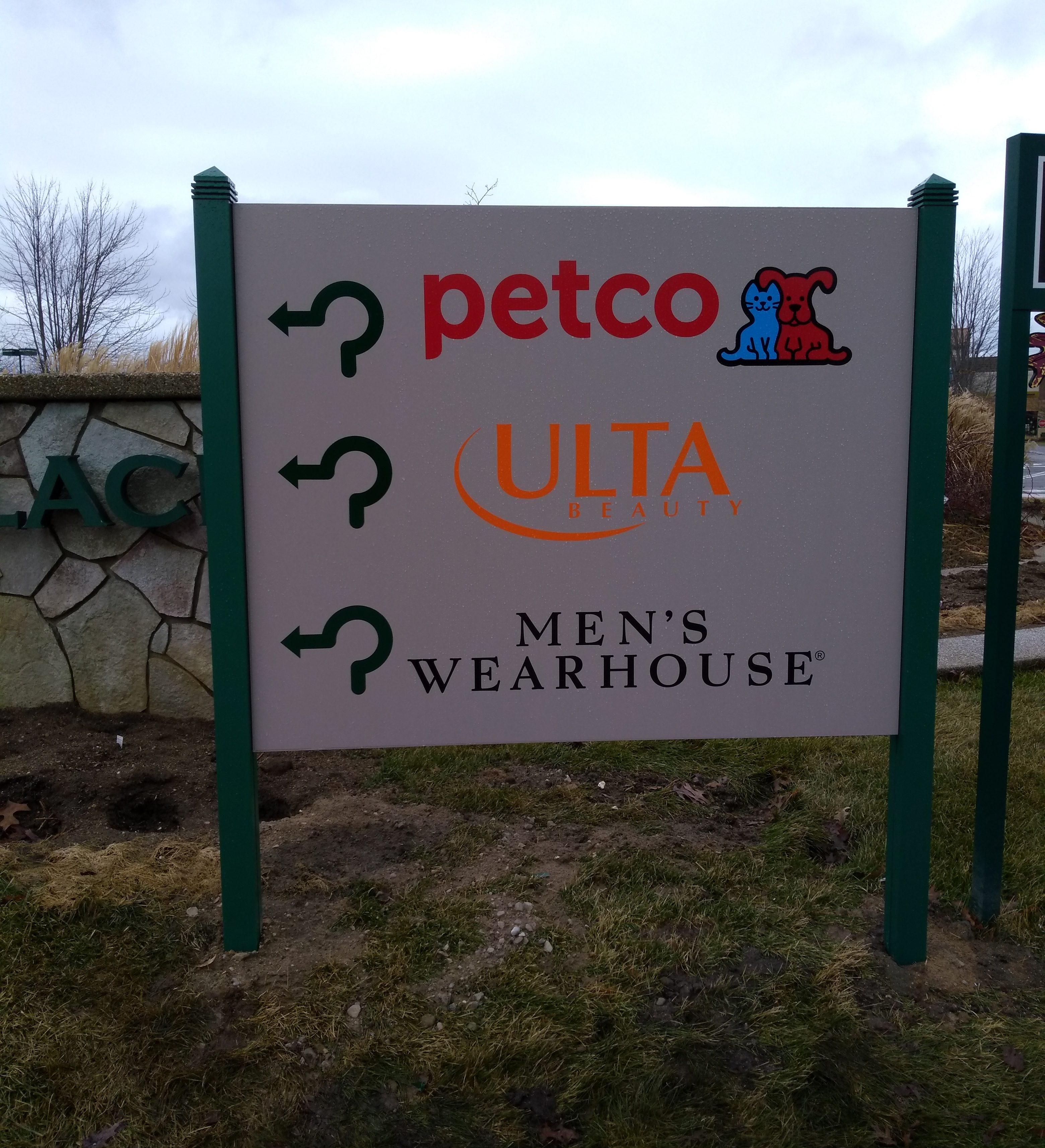 Green Oaks Village Place- Post and Panel Sign "Petco" "Ultra Beauty" "Mens Wearhouse" with arrows