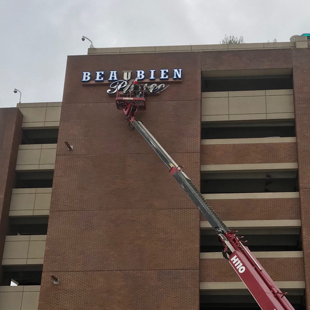 Illuminated Wall Sign being Serviced by our crane