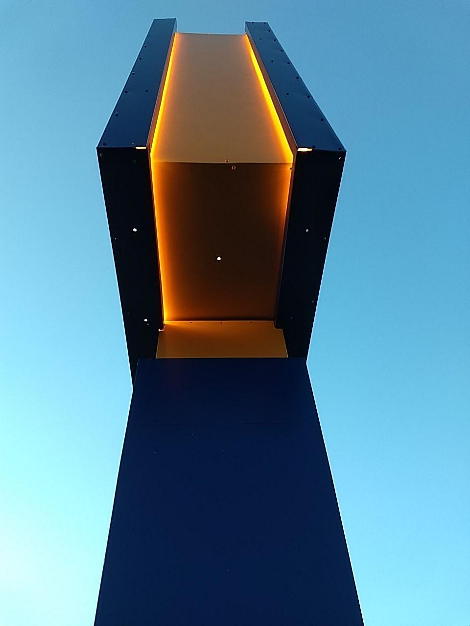 Comfort Inn Pylon Sign Lighting - orange and blue halo lit - side view