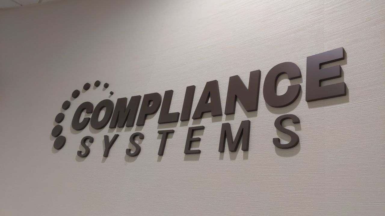 compliance systems custom interior sign letters  and logo router cut bronze wall mounted