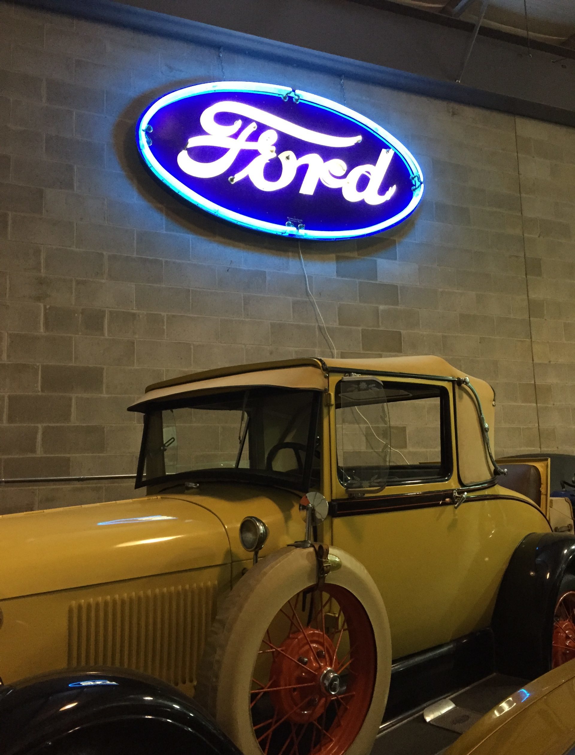 Neon blue and white ford oval logo restoration
