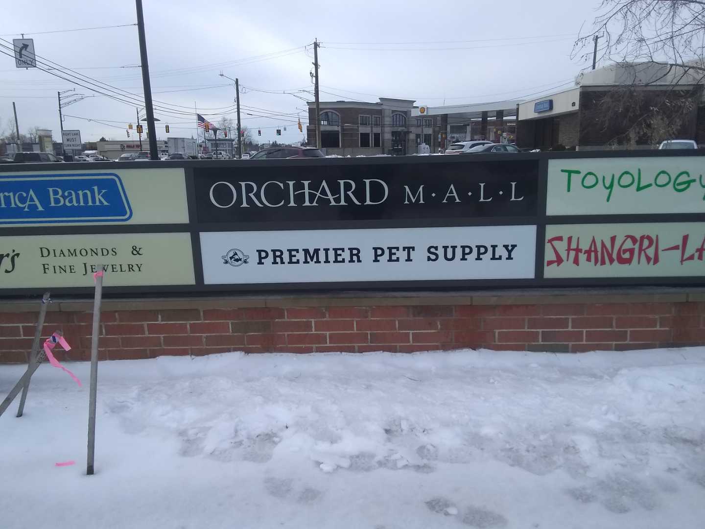 Orchard Mall Premier Pet Face Change on monument plaza sign