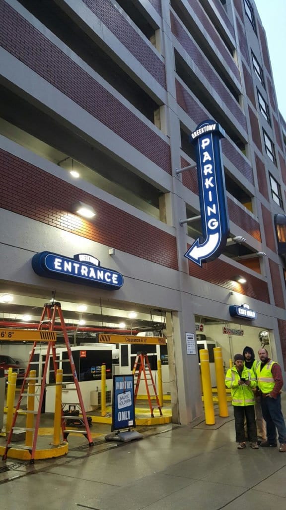 Greektown Parking Garage in Detroit Blade sign with arrow and entrance illuminating signs