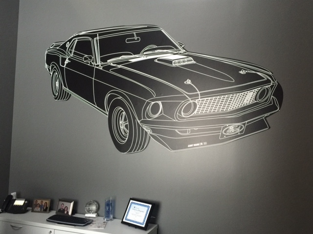 Wall Graphics, gray wall and black car