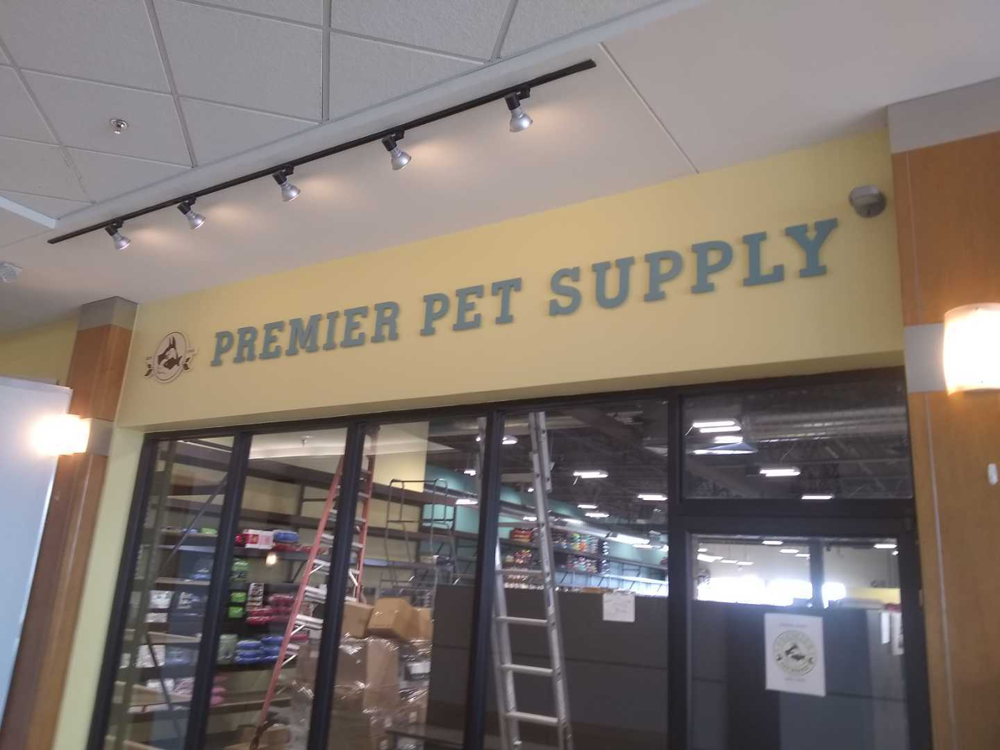 Premier Pet Supply Interior dimensional letters acrylic logo mall storefront external railing lighting spotlight
