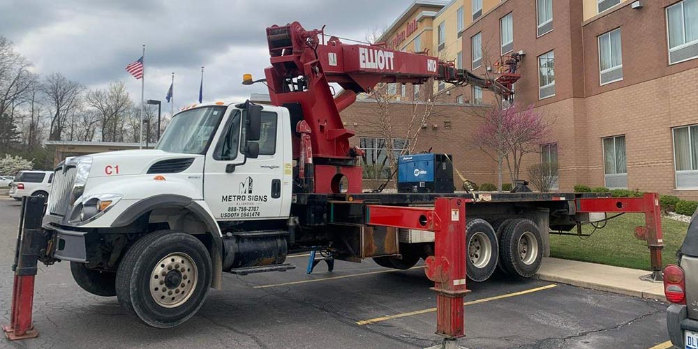 Wall Pack Install Service Crane Truck, Sign company