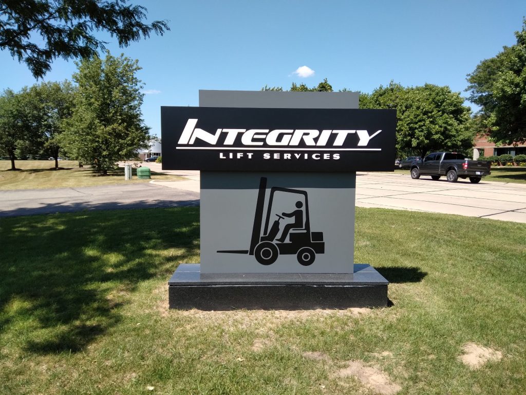 Integrity Lift monument sign with gray and black, forklift logo