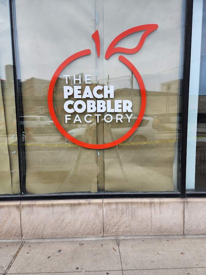 Peach Cobbler Factory vinyl logo window